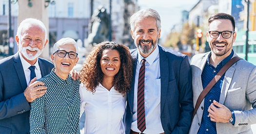 Group of older professionals of different ethnicities and genders.
